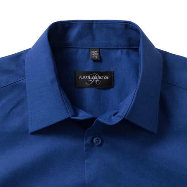 70% Cotton, 30% Polyester. Design: Plain. Fastening: Button. Neckline: Collared. Sleeve-Type: Short-Sleeved. Curved Hem. Length: R.