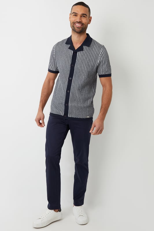 Upgrade your wardrobe this season with this stylish revere collar knitted shirt from Threadbare. This short sleeve knitted shirt has a Milano knit revere collar, placket and tubular cuffs and hem. Complete with full button-down fastening for easy styling. In a textured stripe knit and finished with the Threadbare metal branding tab above the hem. Pair with chino shorts for an effortless summer aesthetic that's great for outings, or make it date night appropriate with a pair of dark denim jeans and trainers.