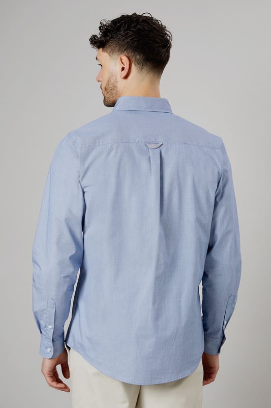 Textured woven fabric for added visual interest
        Button-down collar for a classic look
        Long sleeves with buttoned cuffs
        Subtle embroidered logo on the chest
        Back yoke with centre pleat for enhanced comfort
    
    This Maine long sleeve shirt offers a perfect blend of style and versatility for the modern British gent. The textured fabric adds a touch of sophistication to your casual wardrobe, making it ideal for various occasions. Pair it with chinos and white trainers, as shown, for a relaxed yet put-together look perfect for family gatherings or weekend outings. The button-down collar and clean lines allow for easy transition from day to night, making it a go-to choice for impromptu after-work drinks. For a smart-casual ensemble, layer it under a navy blazer and team with dark denim jeans. The subtle embroidered logo adds a refined touch without being overstated, embodying the understated elegance of British style. Whether you're heading to a casual business meeting or a laid-back dinner with friends, this shirt will ensure you look effortlessly stylish.