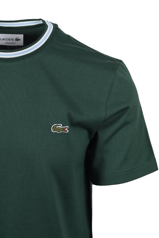 Lacoste Tipped T-shirt Green Lacoste Tipped T-shirt in Green
Elevate your casual wardrobe with the Lacoste Tipped T-Shirt in classic green. This versatile piece offers a perfect blend of style, breathability, and comfort, making it an ideal choice for any occasion. Whether you're catching up with friends on the weekend or heading to work, this t-shirt will quickly become your go-to staple.
Features
Classic Lacoste Design: Showcasing the iconic Lacoste branding, this t-shirt exudes timeless style.
Intricate Detailing: The tipped trims add a touch of sophistication and visual interest.
Premium Quality: Crafted from 100% breathable cotton, ensuring all-day comfort.
Versatile Style
Style code: TH9903