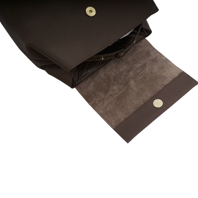 A stylish backpack in our exclusively developed soft milled leather. The unique shape and minimalistic design is ideal for travel and day to day use. A full grain leather bag that provides the space and ease to carry items such as tablets, ipads, notebooks, purses and much more... A hidden button with adjustable tab gives security and allows to maintain the shape of your 'Jermyn' medium-sized full grain leather backpack.
Top grab handle. Lightweight. Fits ipads and tablets. Flap magnet closure. Additional internal adjustable tab for security and space. Adjustable shoulder handle. Adjustable leather shoulder strap. Internal utility features, include: Zip pocket. Fittings colour: Clean Brass. Composition: Body: 100% Genuine Leather. Lining: 100% Cotton.
DISCLAIMER : All pictures shown are for illustration purpose only. Actual product colour may vary due to different ambience lighting or the screen display settings. Size- W27.5cm x H30cm x D16cm.