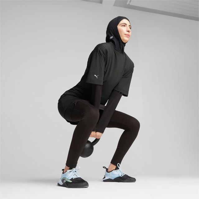 PRODUCT STORY: Go undercover in this loose-fitting tee from PUMA's Modest collection. Designed for fitness fans who prefer to celebrate the body's function over form, its relaxed design is ideal for staying comfortable and casual at the studio or on the go. FEATURES & BENEFITS: Recycled Content: Made with at least 70% recycled material as a step toward a better future.; dryCELL: Performance technology designed to wick moisture from the body and keep you free of sweat during exercise. DETAILS: Regular fit; Crew neck; Short sleeves; Single jersey fabric; Long body.