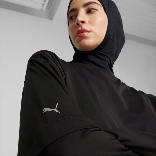 PRODUCT STORY: Go undercover in this loose-fitting tee from PUMA's Modest collection. Designed for fitness fans who prefer to celebrate the body's function over form, its relaxed design is ideal for staying comfortable and casual at the studio or on the go. FEATURES & BENEFITS: Recycled Content: Made with at least 70% recycled material as a step toward a better future.; dryCELL: Performance technology designed to wick moisture from the body and keep you free of sweat during exercise. DETAILS: Regular fit; Crew neck; Short sleeves; Single jersey fabric; Long body.