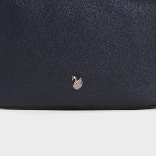 Redefine elegance with the ‘Avon’ soft Nappa leather crossbody bag, a perfect fusion of luxury, craftsmanship, and practicality. Expertly handcrafted from the finest full-grain soft Nappa leather, this premium bag is designed for those who appreciate timeless sophistication and effortless style. Whether you're heading to work, a casual outing, or an evening event, the ‘Avon’ crossbody bag is your go-to accessory for effortless sophistication and refined style. Premium Full-Grain Nappa Leather – Crafted from the softest and most supple genuine leather, offering a luxurious touch and exceptional durability. Smart & Functional Design – Double zipped compartments for easy organisation and secure storage. Spacious interior to accommodate your daily essentials with ease. Adjustable Leather Shoulder Strap – Designed for custom comfort, allowing you to wear it as a crossbody or shoulder bag. Lightweight & Versatile – A perfect everyday companion, seamlessly blending style and functionality. Signature Assots ‘Swan’ Collection – Embellished with the iconic ‘Swan’ logo, symbolising elegance, grace, and superior craftsmanship. Additional Internal Features - Slip-in pocket for your mobile phone, car keys and house keys. Fittings Colour: Silver. Composition: Body: 100% Genuine Leather, Lining: Polyester. Size: 14cm x 20cm x 7cm