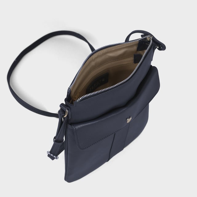 The ‘Amba’ soft Nappa leather crossbody bag blends luxury, craftsmanship, and practicality in a timeless design. Handcrafted from premium full-grain Nappa leather, it’s the perfect companion for work, casual outings, or evening events. Elegant yet versatile, this bag exudes refined sophistication while offering effortless style and functionality. Premium Full-Grain Nappa Leather – Crafted from the softest and most supple genuine leather, offering a luxurious touch and exceptional durability. Smart & Functional Design – Secured zip opens to a roomy main compartment for easy organisation and secure storage. Fully lined with fresh cream polyester fabric to easily spot your essentials. Mulitpockets - Magnetic fastening flap pocket to easily slide in your essentials. Secured back zip pocket provides extra room to organise when you're out and about. Adjustable Leather Shoulder Strap – Designed for custom comfort, allowing you to adjust the length of the strap to suit your needs. Lightweight & Versatile – A perfect everyday companion, seamlessly blending style and functionality. Signature Assots ‘Swan’ Collection – Embellished with the iconic ‘Swan’ logo, symbolising elegance, grace, and superior craftsmanship. Additional Internal Features - Secured zip pocket for your mobile phone, car keys and house keys. Fittings Colour: Silver. Composition: Body: 100% Genuine Leather, Lining: Polyester. Size: 24cm x 21cm x 1.5cm