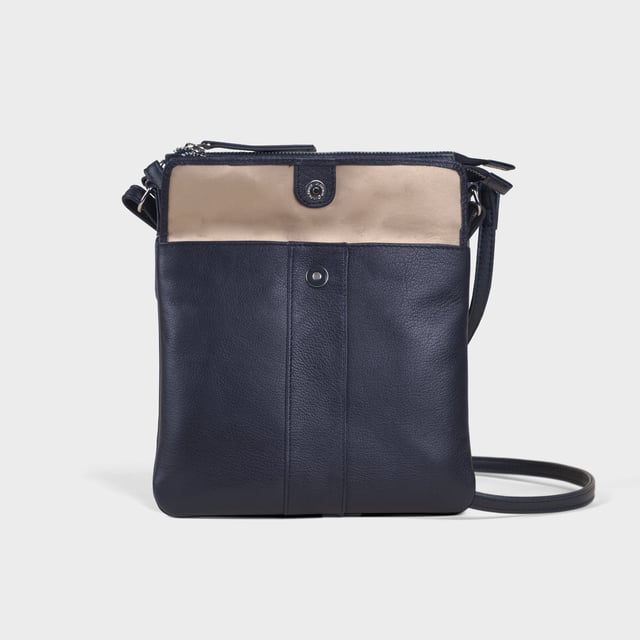 The ‘Amba’ soft Nappa leather crossbody bag blends luxury, craftsmanship, and practicality in a timeless design. Handcrafted from premium full-grain Nappa leather, it’s the perfect companion for work, casual outings, or evening events. Elegant yet versatile, this bag exudes refined sophistication while offering effortless style and functionality. Premium Full-Grain Nappa Leather – Crafted from the softest and most supple genuine leather, offering a luxurious touch and exceptional durability. Smart & Functional Design – Secured zip opens to a roomy main compartment for easy organisation and secure storage. Fully lined with fresh cream polyester fabric to easily spot your essentials. Mulitpockets - Magnetic fastening flap pocket to easily slide in your essentials. Secured back zip pocket provides extra room to organise when you're out and about. Adjustable Leather Shoulder Strap – Designed for custom comfort, allowing you to adjust the length of the strap to suit your needs. Lightweight & Versatile – A perfect everyday companion, seamlessly blending style and functionality. Signature Assots ‘Swan’ Collection – Embellished with the iconic ‘Swan’ logo, symbolising elegance, grace, and superior craftsmanship. Additional Internal Features - Secured zip pocket for your mobile phone, car keys and house keys. Fittings Colour: Silver. Composition: Body: 100% Genuine Leather, Lining: Polyester. Size: 24cm x 21cm x 1.5cm
