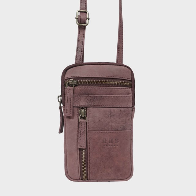 'BROOKE' Real Leather Mobile Phone Crossbody Bag Introducing 'Brooke', the perfect companion for the urban life. Beautifully handcrafted from real leather and with adjustable shoulder handles, its timeless finesse and multi-pocketed design is both elegant and practical, allowing you to move around with effortless grace. The ideal travel crossbody phone bag for everyday use.
One main zip pocket compartment to fit in your daily essentials. Two front zip pockets to slide in your house keys, car keys and more. Front slip pocket to slide in your cardholder. Full length zip pocket at the back to slide in your credit cards, membership cards and more. Adjustable leather shoulder handles for a comfortable carry. Fittings Colour: Antique Brass. Composition: Body: 100% Genuine Leather. Lining: Polyester Mix.
DISCLAIMER : All pictures shown are for illustration purpose only. Actual product colour may vary due to different ambience lighting or the screen display settings. Size- W10.5cm x H18.5cm x D2cm.