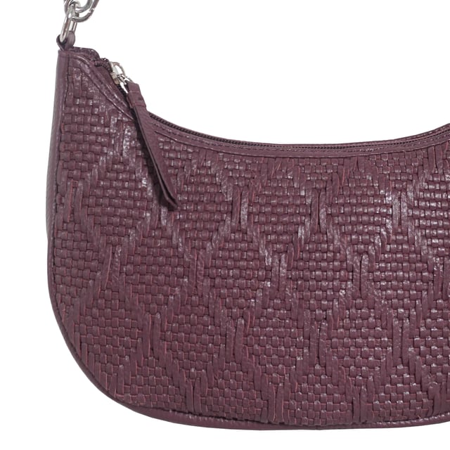 Indulge in luxury with the Assots Premium 'Wonder Weave' Real Leather Woven Designer Shoulder Crossbody Bag. Meticulously crafted with articulate weaving, this bag exudes sophistication and perfection. Its artisanal slot weave creates a unique sense of movement and texture, making it a versatile and luxurious everyday companion. Its versatile design allows it to be worn as a crossbody or shoulder bag, with detachable handles for convenience. Beautiful diamond shaped weaving with the finest full grain genuine leather. Detachable shoulder and crossbody handles to be worn as a crossbody bag or a shoulder bag. Lightweight. Secured zip closure opens to a fully lined and roomy compartment to accommodate all your essentials. Internal zip pocket for your smartphone, house keys and car keys. Available in 13 more elegant colours. Fittings Colour: Silver Nickel. Composition: Body: 100% Genuine Leather, Lining: Polyester. DISCLAIMER: All pictures shown are for illustration purpose only. Actual product colour may vary due to different ambience lighting or the screen display settings. Size- W29cm x H18cm x D8cm.