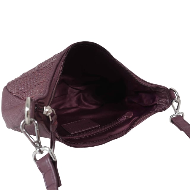 Indulge in luxury with the Assots Premium 'Wonder Weave' Real Leather Woven Designer Shoulder Crossbody Bag. Meticulously crafted with articulate weaving, this bag exudes sophistication and perfection. Its artisanal slot weave creates a unique sense of movement and texture, making it a versatile and luxurious everyday companion. Its versatile design allows it to be worn as a crossbody or shoulder bag, with detachable handles for convenience. Beautiful diamond shaped weaving with the finest full grain genuine leather. Detachable shoulder and crossbody handles to be worn as a crossbody bag or a shoulder bag. Lightweight. Secured zip closure opens to a fully lined and roomy compartment to accommodate all your essentials. Internal zip pocket for your smartphone, house keys and car keys. Available in 13 more elegant colours. Fittings Colour: Silver Nickel. Composition: Body: 100% Genuine Leather, Lining: Polyester. DISCLAIMER: All pictures shown are for illustration purpose only. Actual product colour may vary due to different ambience lighting or the screen display settings. Size- W29cm x H18cm x D8cm.