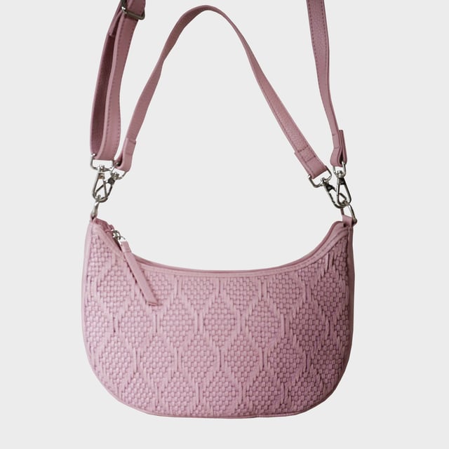 Indulge in luxury with the Assots Premium 'Wonder Weave' Real Leather Woven Designer Shoulder Crossbody Bag. Meticulously crafted with articulate weaving, this bag exudes sophistication and perfection. Its artisanal slot weave creates a unique sense of movement and texture, making it a versatile and luxurious everyday companion. Its versatile design allows it to be worn as a crossbody or shoulder bag, with detachable handles for convenience. Beautiful diamond shaped weaving with the finest full grain genuine leather. Detachable shoulder and crossbody handles to be worn as a crossbody bag or a shoulder bag. Lightweight. Secured zip closure opens to a fully lined and roomy compartment to accommodate all your essentials. Internal zip pocket for your smartphone, house keys and car keys. Available in 13 more elegant colours. Fittings Colour: Silver Nickel. Composition: Body: 100% Genuine Leather, Lining: Polyester. DISCLAIMER: All pictures shown are for illustration purpose only. Actual product colour may vary due to different ambience lighting or the screen display settings. Size- W29cm x H18cm x D8cm.