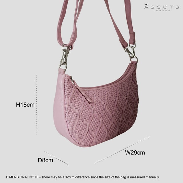 Indulge in luxury with the Assots Premium 'Wonder Weave' Real Leather Woven Designer Shoulder Crossbody Bag. Meticulously crafted with articulate weaving, this bag exudes sophistication and perfection. Its artisanal slot weave creates a unique sense of movement and texture, making it a versatile and luxurious everyday companion. Its versatile design allows it to be worn as a crossbody or shoulder bag, with detachable handles for convenience. Beautiful diamond shaped weaving with the finest full grain genuine leather. Detachable shoulder and crossbody handles to be worn as a crossbody bag or a shoulder bag. Lightweight. Secured zip closure opens to a fully lined and roomy compartment to accommodate all your essentials. Internal zip pocket for your smartphone, house keys and car keys. Available in 13 more elegant colours. Fittings Colour: Silver Nickel. Composition: Body: 100% Genuine Leather, Lining: Polyester. DISCLAIMER: All pictures shown are for illustration purpose only. Actual product colour may vary due to different ambience lighting or the screen display settings. Size- W29cm x H18cm x D8cm.