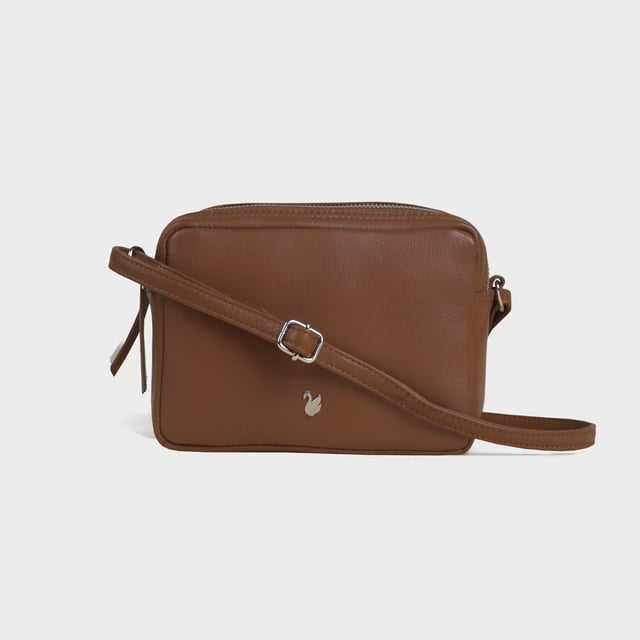 Redefine elegance with the ‘Avon’ soft Nappa leather crossbody bag, a perfect fusion of luxury, craftsmanship, and practicality. Expertly handcrafted from the finest full-grain soft Nappa leather, this premium bag is designed for those who appreciate timeless sophistication and effortless style. Whether you're heading to work, a casual outing, or an evening event, the ‘Avon’ crossbody bag is your go-to accessory for effortless sophistication and refined style. Premium Full-Grain Nappa Leather – Crafted from the softest and most supple genuine leather, offering a luxurious touch and exceptional durability. Smart & Functional Design – Double zipped compartments for easy organisation and secure storage. Spacious interior to accommodate your daily essentials with ease. Adjustable Leather Shoulder Strap – Designed for custom comfort, allowing you to wear it as a crossbody or shoulder bag. Lightweight & Versatile – A perfect everyday companion, seamlessly blending style and functionality. Signature Assots ‘Swan’ Collection – Embellished with the iconic ‘Swan’ logo, symbolising elegance, grace, and superior craftsmanship. Additional Internal Features - Slip-in pocket for your mobile phone, car keys and house keys. Fittings Colour: Silver. Composition: Body: 100% Genuine Leather, Lining: Polyester. Size: 14cm x 20cm x 7cm