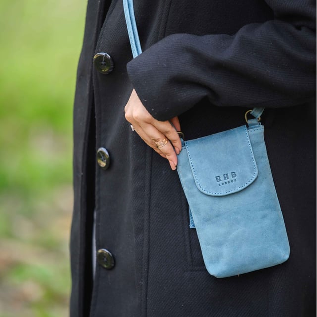 'THEA' Real Leather Mobile Phone Crossbody Bag The 'Thea' mobile phone crossbody bag is an elegant and practical mobile phone crossbody bag crafted from the finest genuine leather. Magnetic closure and a flap design give effortless and secure access, while its adjustable shoulder handle allows you to customize the fit. Perfect for your everyday needs.
Secured magnetic flap closure opens to a fully lined interior. Adjustable leather shoulder handle for a comfortable carry. Full length secured back zip pocket to slide in your essentials when you're out and about. Lightweight. Fittings Colour: Antique Brass. Composition: Body: 100% Genuine Leather. Lining: Polyester Mix.
DISCLAIMER : All pictures shown are for illustration purpose only. Actual product colour may vary due to different ambience lighting or the screen display settings. Size- W11.5cm x H19cm x D2.5cm.
