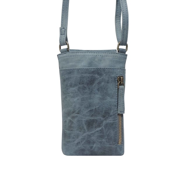 'THEA' Real Leather Mobile Phone Crossbody Bag The 'Thea' mobile phone crossbody bag is an elegant and practical mobile phone crossbody bag crafted from the finest genuine leather. Magnetic closure and a flap design give effortless and secure access, while its adjustable shoulder handle allows you to customize the fit. Perfect for your everyday needs.
Secured magnetic flap closure opens to a fully lined interior. Adjustable leather shoulder handle for a comfortable carry. Full length secured back zip pocket to slide in your essentials when you're out and about. Lightweight. Fittings Colour: Antique Brass. Composition: Body: 100% Genuine Leather. Lining: Polyester Mix.
DISCLAIMER : All pictures shown are for illustration purpose only. Actual product colour may vary due to different ambience lighting or the screen display settings. Size- W11.5cm x H19cm x D2.5cm.