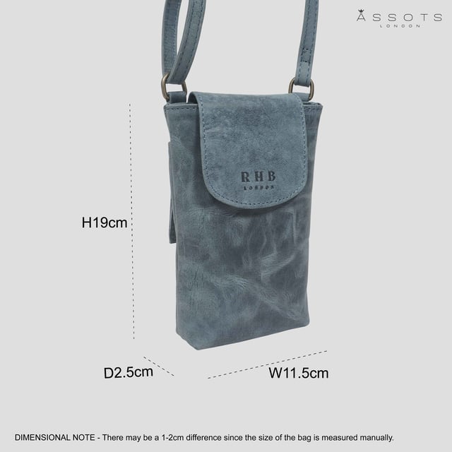 'THEA' Real Leather Mobile Phone Crossbody Bag The 'Thea' mobile phone crossbody bag is an elegant and practical mobile phone crossbody bag crafted from the finest genuine leather. Magnetic closure and a flap design give effortless and secure access, while its adjustable shoulder handle allows you to customize the fit. Perfect for your everyday needs.
Secured magnetic flap closure opens to a fully lined interior. Adjustable leather shoulder handle for a comfortable carry. Full length secured back zip pocket to slide in your essentials when you're out and about. Lightweight. Fittings Colour: Antique Brass. Composition: Body: 100% Genuine Leather. Lining: Polyester Mix.
DISCLAIMER : All pictures shown are for illustration purpose only. Actual product colour may vary due to different ambience lighting or the screen display settings. Size- W11.5cm x H19cm x D2.5cm.