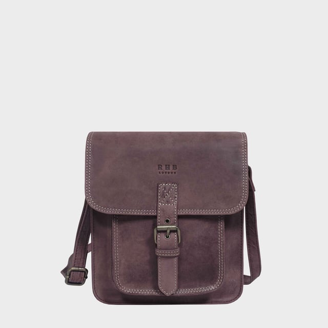 Introducing 'Carolyn', the ultimate luxury handbag crafted from the finest real leather. Featuring a sophisticated flap closure with magnetic fastening, 'Carolyn' is as beautifully structured as it is stylish, with three large compartments for all your essentials. Perfect for any occasion, 'Carolyn' is your perfect companion for effortless elegance. Secured magnetic flap closure. Opens to three roomy main compartments to slide in your tablet, ipad, notebooks and more. Fully lined interiors in natural beige polyester fabric. Zipped middle compartment to slide in your mobile phone, car keys, house keys and more. 
Full width back zip pocket provides extra space for organising your essentials. Lightweight. Mock buckle on the front for that designer sophisticated look. 
Slider adjustable leather shoulder handle for a comfortable carry. Graced with the Signature 'Real Hide Bag' insignia, the iconic RHB emboss is intricately etched into the exterior of the front flap. Fittings Colour: Antique Brass. Composition: Body: 100% Genuine Leather. Lining: Polyester.
DISCLAIMER : All pictures shown are for illustration purpose only. Actual product colour may vary due to different ambience lighting or the screen display settings. Size- W25cm x H21cm x D7cm.