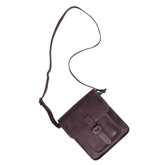 Introducing 'Carolyn', the ultimate luxury handbag crafted from the finest real leather. Featuring a sophisticated flap closure with magnetic fastening, 'Carolyn' is as beautifully structured as it is stylish, with three large compartments for all your essentials. Perfect for any occasion, 'Carolyn' is your perfect companion for effortless elegance. Secured magnetic flap closure. Opens to three roomy main compartments to slide in your tablet, ipad, notebooks and more. Fully lined interiors in natural beige polyester fabric. Zipped middle compartment to slide in your mobile phone, car keys, house keys and more. 
Full width back zip pocket provides extra space for organising your essentials. Lightweight. Mock buckle on the front for that designer sophisticated look. 
Slider adjustable leather shoulder handle for a comfortable carry. Graced with the Signature 'Real Hide Bag' insignia, the iconic RHB emboss is intricately etched into the exterior of the front flap. Fittings Colour: Antique Brass. Composition: Body: 100% Genuine Leather. Lining: Polyester.
DISCLAIMER : All pictures shown are for illustration purpose only. Actual product colour may vary due to different ambience lighting or the screen display settings. Size- W25cm x H21cm x D7cm.