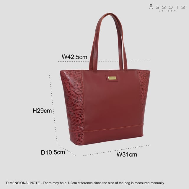 The ‘Klara’ large unlined tote bag is beautifully handcrafted with designer Animal Snake Print Leather on the sides and premium smooth leather on the front and back. It features a zip top closure for you to store your essentials safely and securely. This leather shopper is designed to ensure you don’t run out of space and have ample room for all your necessities when you’re out and about. Stand out with ‘Klara’, the perfect travel companion ideal for all occasions.
Secured zip top closure opens to a roomy unlined interior. Easily fits a 13-inch laptop. Double stitching on the handles for extra reinforcement and strength to avoid handle snapping. Reinforced base to avoid bulging when stuffed. Unlined natural leather shopper made to last a lifetime. Leather shoulder handle for easy pick up and go. Adorned with the inimitable Assots London brushed gold clean finish logo demonstrating it’s premium quality. Fittings colour: Antique Brass. Composition: Body: 100% Genuine Leather. Lining: Unlined.
DISCLAIMER : All pictures shown are for illustration purpose only. Actual product colour may vary due to different ambience lighting or the screen display settings. Size- W42.5cm x H29cm x D10.5cm.