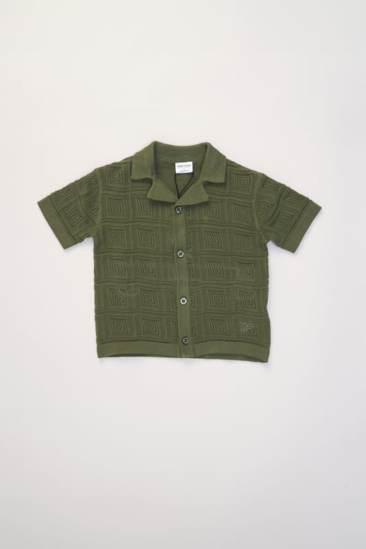 This True Knit resort shirt and shorts set from Norn Studios features a cool patterned design, perfect for summer days and getaways. The lightweight, breathable fabric keeps your little one cool, while the matching shorts complete the relaxed, vacation-ready look. Ideal for sunny adventures and laid-back afternoons.