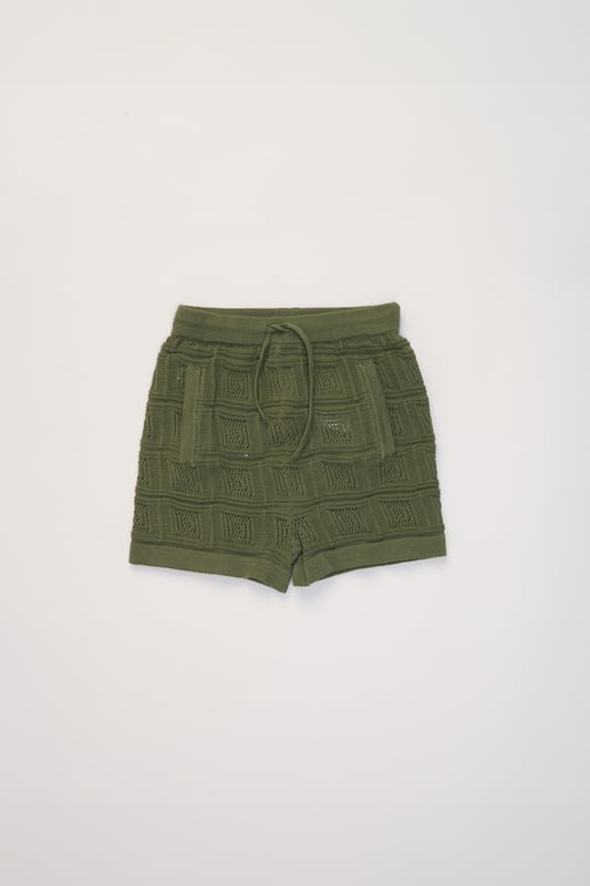 This True Knit resort shirt and shorts set from Norn Studios features a cool patterned design, perfect for summer days and getaways. The lightweight, breathable fabric keeps your little one cool, while the matching shorts complete the relaxed, vacation-ready look. Ideal for sunny adventures and laid-back afternoons.