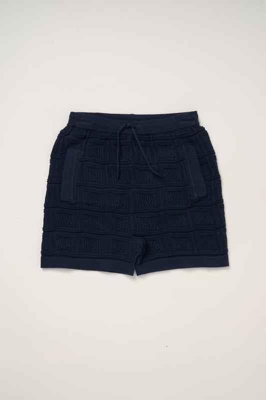 This True Knit resort shirt and shorts set from Norn Studios features a cool patterned design, perfect for summer days and getaways. The lightweight, breathable fabric keeps your little one cool, while the matching shorts complete the relaxed, vacation-ready look. Ideal for sunny adventures and laid-back afternoons.