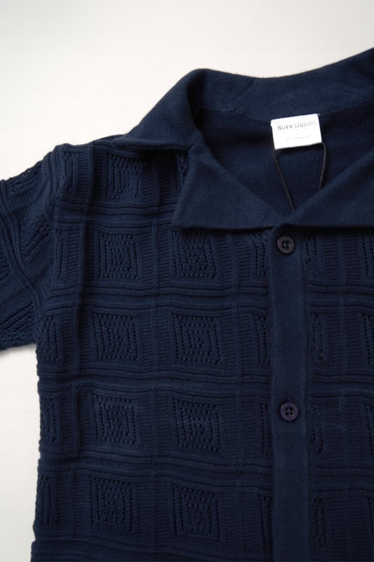 This True Knit resort shirt and shorts set from Norn Studios features a cool patterned design, perfect for summer days and getaways. The lightweight, breathable fabric keeps your little one cool, while the matching shorts complete the relaxed, vacation-ready look. Ideal for sunny adventures and laid-back afternoons.
