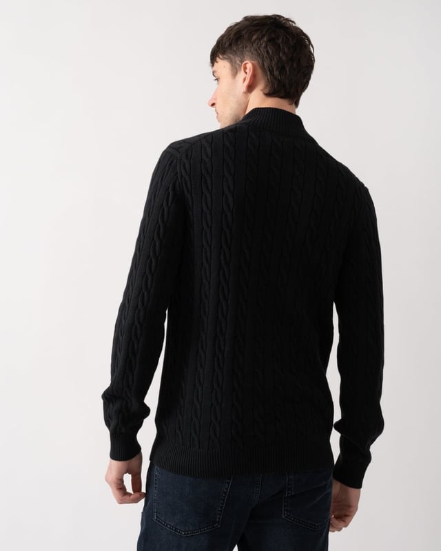 Designed in cotton with an all-over cable knit structure, this soft sweater has a regular fit and sporty half-zip collar. A preppy essential, it is detailed with our iconic GANT shield embroidered at the chest, and ribbed endings at the neck, hem and cuffs.
Regular fitHalf-zip collarCable knit structureGANT graphic embroidered at chest
 
100% Cotton
 