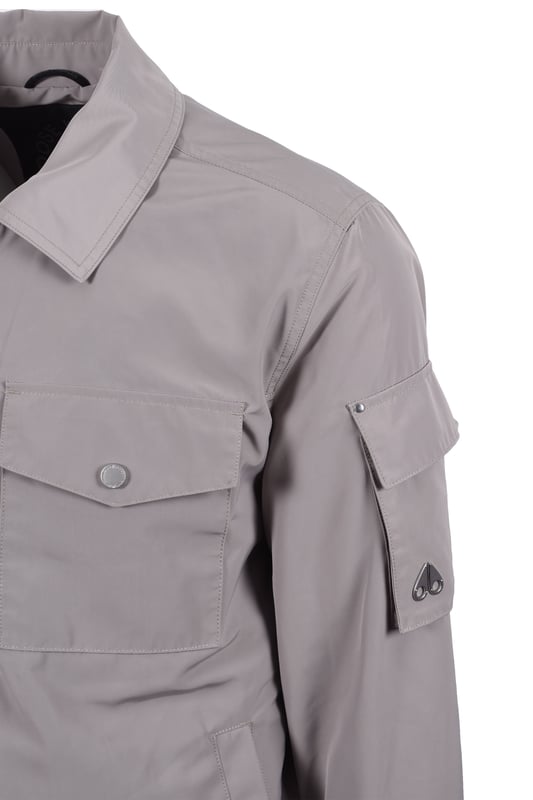 Moose Knuckles Charlesbourg Jacket Dusk Moose Knuckles Charlesbourg Jacket in Dusk
The Moose Knuckles Charlesbourg Overshirt in Dusk offers a refined, minimalist touch to your outerwear. Perfect for transitional weather, this lightweight and weather-resistant piece provides a versatile layer. It features a practical full-zip closure, two buttoning chest pockets, and two convenient slip-side pockets. A subtle metal logo badge on the upper left sleeve adds a signature touch. Crafted from 100% polyester, this overshirt combines comfort and durability.
Features
Full-zip closure: Provides easy on and off and adjustable warmth.
Two buttoning chest pockets: Offer secure storage for essentials.
Two slip-side pockets: Provide additional hand warmth and storage.
Small metal logo badge on the upper left sleeve.
100% Polyester construction: Ensures durability and weather resistance.
Style code: M15MJ142