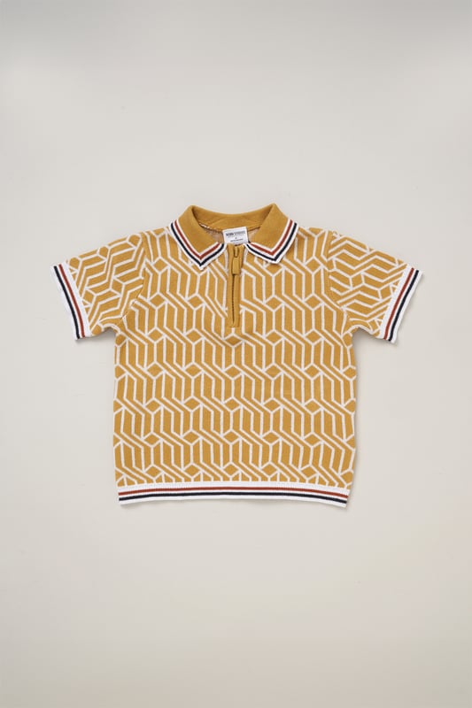 This True Knit patterned polo shirt and matching shorts set from Norn Studios features a stylish design with a drawstring waist for a comfortable fit. Perfect for day or night wear, it combines a classic look with practical comfort, making it an ideal choice for your little one’s casual adventures.