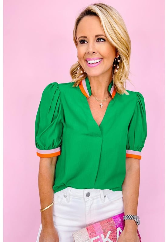 Bright green blouse with colorful trim
  V
  neck with collar detail
  Stylish puff sleeves with trim
  Versatile piece for both formal and casual occasions
  Relaxed fit
  Available in sizes S to XL
  Made of high
  quality material for comfort
