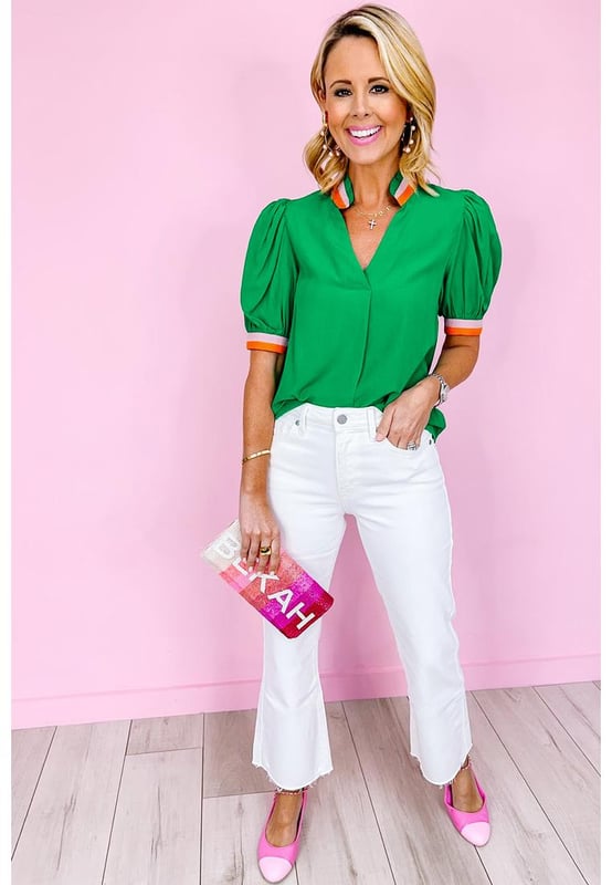 Bright green blouse with colorful trim
  V
  neck with collar detail
  Stylish puff sleeves with trim
  Versatile piece for both formal and casual occasions
  Relaxed fit
  Available in sizes S to XL
  Made of high
  quality material for comfort