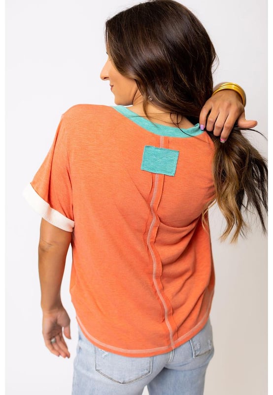 Grapefruit Orange Contrast Trim Exposed Seam
  V Neck T
  shirt
  Trendy contrast trim adds a color block effect
  Visible stitching creates a unique and fashionable look
  V
  neck cut flatters your neckline and adds a feminine touch
  Soft and breathable fabrics
  Perfect for everyday wear
  High elasticity
  Unisex
Material: 65% Polyester 35% Cotton