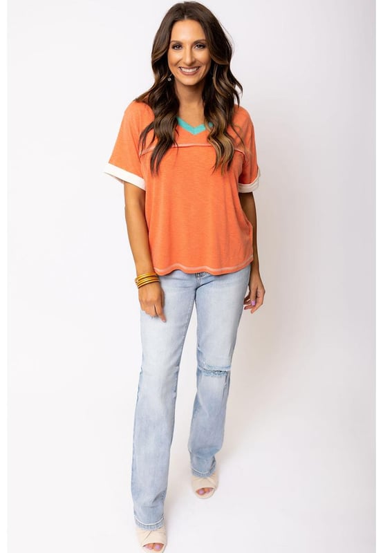 Grapefruit Orange Contrast Trim Exposed Seam
  V Neck T
  shirt
  Trendy contrast trim adds a color block effect
  Visible stitching creates a unique and fashionable look
  V
  neck cut flatters your neckline and adds a feminine touch
  Soft and breathable fabrics
  Perfect for everyday wear
  High elasticity
  Unisex
Material: 65% Polyester 35% Cotton