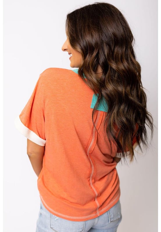 Grapefruit Orange Contrast Trim Exposed Seam
  V Neck T
  shirt
  Trendy contrast trim adds a color block effect
  Visible stitching creates a unique and fashionable look
  V
  neck cut flatters your neckline and adds a feminine touch
  Soft and breathable fabrics
  Perfect for everyday wear
  High elasticity
  Unisex
Material: 65% Polyester 35% Cotton
