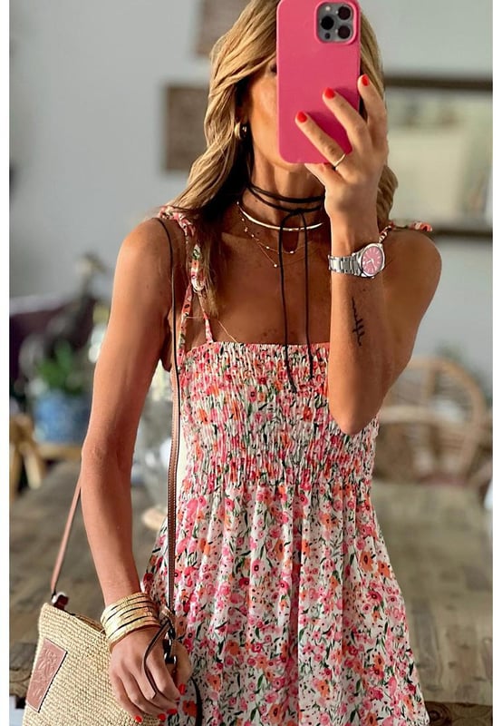 White Boho Floral Smocked Ruffled Maxi Dress
  Allover floral print for a chic boho touch
  Smocked bodice and flowy maxi silhouette for comfort
  Self
  tie straps for added style
  Perfect for traveling and taking photos
  Available in sizes S
  XL
Material: 100% Polyester