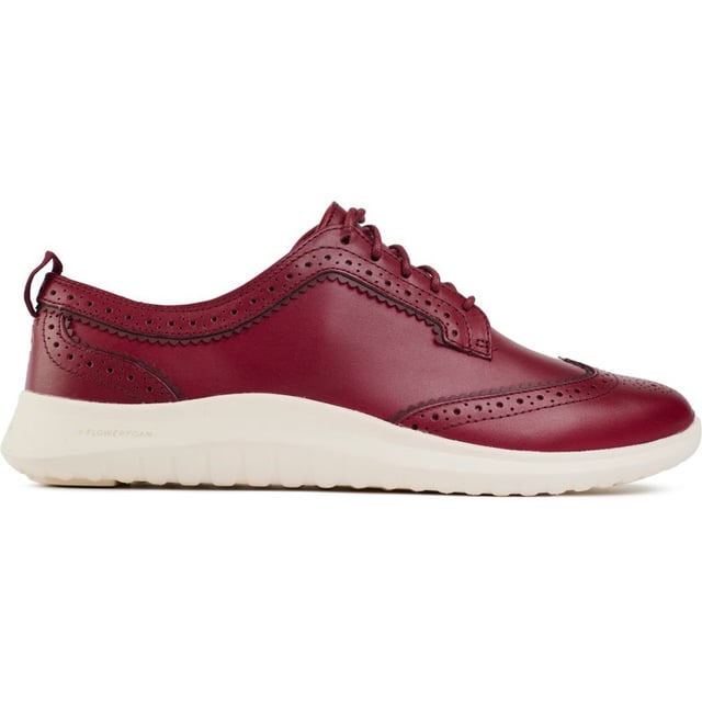Cole Haan's new 21st-century take on the wingtip, the ZERØGRAND Meritt Wingtip Oxford shoe, in rich leather, has the full complement of traditional broguing and pinking, over the outrageously lightweight CH FlowerFoam sole. The stylish lace-up shoe sports the Zerøgrand technology, offering responsive cushioning and durable shock absorption. For the modern woman, this Cole Haan staple delivers comfort and sophistication with every step.