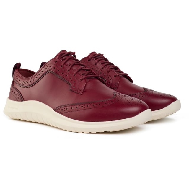 Cole Haan's new 21st-century take on the wingtip, the ZERØGRAND Meritt Wingtip Oxford shoe, in rich leather, has the full complement of traditional broguing and pinking, over the outrageously lightweight CH FlowerFoam sole. The stylish lace-up shoe sports the Zerøgrand technology, offering responsive cushioning and durable shock absorption. For the modern woman, this Cole Haan staple delivers comfort and sophistication with every step.