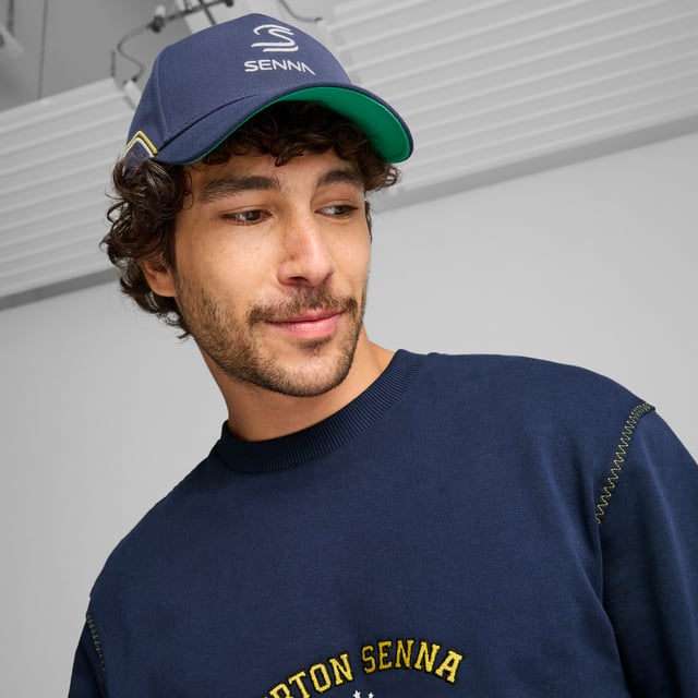 PRODUCT STORY: Explore the story of Ayrton Senna with the SENNA A VIDA cap. This iconic piece is a tribute to the life of the legendary Formula 1® driver, celebrating his passion for racing and the legacy he left behind as one of the best drivers in history. It has a 5-panel design and features AYRTON SENNA embroideries. FEATURES & BENEFITS: Made with at least 50% recycled materials. DETAILS: Curved brim; Snapback closure; 5-panel cap; AYRTON SENNA embroidered graphics; PUMA branding details.