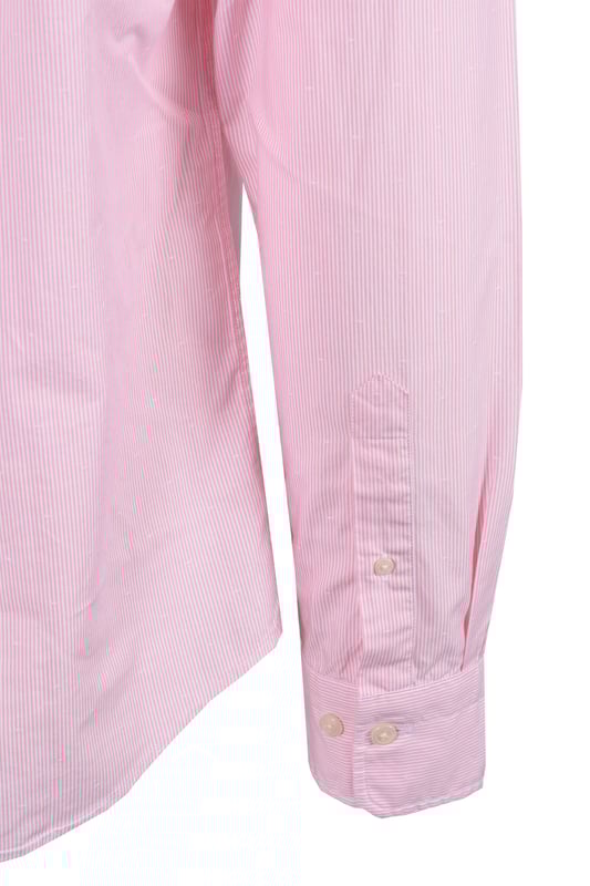 Gant Reg Dobby Dot Stripe Shirt in Geranium Pink
Elevate your casual style with the Gant Reg Dobby Dot Stripe Shirt in a vibrant geranium pink. This shirt is expertly crafted from premium 100% cotton, offering exceptional comfort and breathability throughout the day. The unique dobby dot and yarn-dyed stripe design adds a touch of texture and visual interest, making it a standout piece in your wardrobe.   
 
Designed for a classic regular fit, this shirt features a timeless button-down collar, a practical chest pocket, and adjustable cuffs for a personalised feel. The curved hem ensures a clean and polished look, whether worn tucked or untucked.   
 
Attention to detail is paramount, with recycled polyester buttons contributing to a more sustainable approach. A subtle yet iconic GANT shield graphic is embroidered at the chest, signifying the brand's heritage and quality.
 
Features

100% Premium Cotton
Dobby Dot and Yarn-Dyed Stripe Design
Regular Fit
Button-Down Collar
Chest Pocket
Adjustable Cuffs
Curved Hem
Recycled Polyester Buttons
Embroidered GANT Shield Graphic
Style code: 3250081