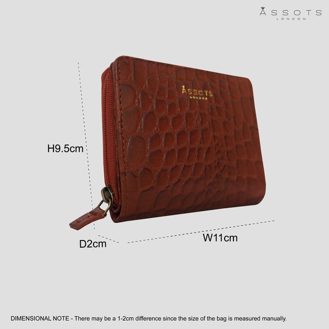 The 'Jolly' compact RFID equipped wallet purse is perfectly handcrafted with premium vintage Croc real leather for that designer look. This timeless design wallet purse easily fits in your bag or pocket featuring multiple card slots, slip pockets and a zip pocket. Organise your belongings with ease with 'Jolly' the perfect medium sized wallet purse.
Riveted closure for safe and secure storage. Zip compartment for you to store your coins and keys. Equipped with RFID technology to keep you safe from modern theft. Three card slots and three slip pockets for you to store your cards and notes. Compact size fitting easily in your bag or pocket. Fittings: Clean Brass. Composition: Body: 100% Genuine Leather. Lining: Polyester.
DISCLAIMER : All pictures shown are for illustration purpose only. Actual product colour may vary due to different ambience lighting or the screen display settings. Size- W11cm x H9.5cm x D2cm.
