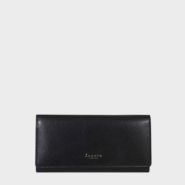 The ‘Claire’ flapover ladies purse is handcrafted with the Assots premium 'Giovani' Italian Polished vegetable tanned leather. Equipped with RFID technology, this practical ladies purse features a magnetic fastening closure with plenty of room to organise your cash, cards and coins. This large leather ladies purse is perfect to compliment your handbag and fits in easily. Stay safe and organised with ‘Claire’ the perfect addition to your collection of purses ideal for all outfits and occasions.
Secured flap over magnetic fastening closure to store your essentials safely and securely. Foldover flap design. Equipped with RFID technology for safety.
Additional back zip pocket to ensure you don’t run out of space. Two note compartments. Eight internal card compartments. Two windowed ID slots. Assots branded lined interiors. Lightweight for easy carry. Fittings Colour: Clean Brass. Composition: Body: 100% Genuine Leather. Lining: 100% Cotton.
DISCLAIMER : All pictures shown are for illustration purpose only. Actual product colour may vary due to different ambience lighting or the screen display settings. Size - W20cm x H10.5cm x D2.5cm.