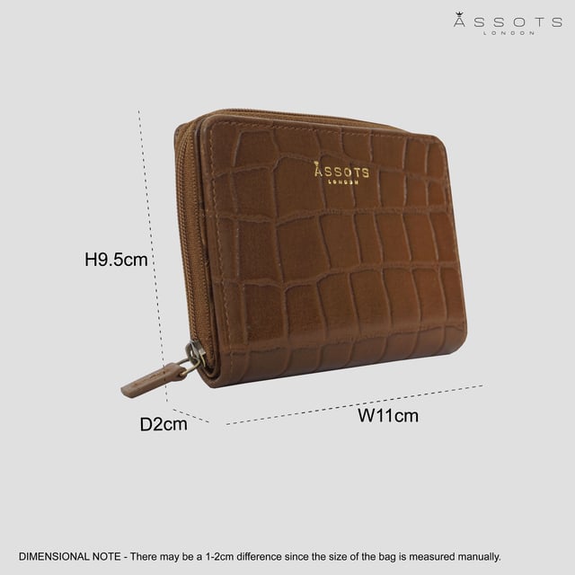 The 'Jolly' compact RFID equipped wallet purse is perfectly handcrafted with premium vintage Croc real leather for that designer look. This timeless design wallet purse easily fits in your bag or pocket featuring multiple card slots, slip pockets and a zip pocket. Organise your belongings with ease with 'Jolly' the perfect medium sized wallet purse.
Riveted closure for safe and secure storage. Zip compartment for you to store your coins and keys. Equipped with RFID technology to keep you safe from modern theft. Three card slots and three slip pockets for you to store your cards and notes. Compact size fitting easily in your bag or pocket. Fittings: Clean Brass. Composition: Body: 100% Genuine Leather. Lining: Polyester.
DISCLAIMER : All pictures shown are for illustration purpose only. Actual product colour may vary due to different ambience lighting or the screen display settings. Size- W11cm x H9.5cm x D2cm.