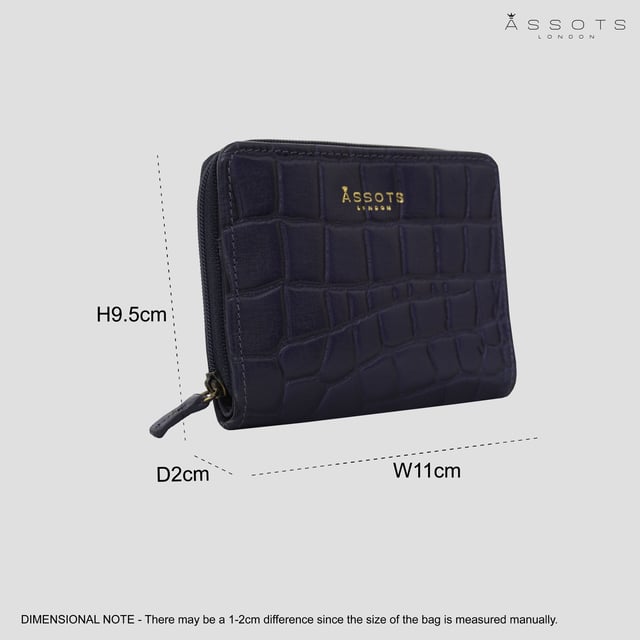 The 'Jolly' compact RFID equipped wallet purse is perfectly handcrafted with premium vintage Croc real leather for that designer look. This timeless design wallet purse easily fits in your bag or pocket featuring multiple card slots, slip pockets and a zip pocket. Organise your belongings with ease with 'Jolly' the perfect medium sized wallet purse.
Riveted closure for safe and secure storage. Zip compartment for you to store your coins and keys. Equipped with RFID technology to keep you safe from modern theft. Three card slots and three slip pockets for you to store your cards and notes. Compact size fitting easily in your bag or pocket. Fittings: Clean Brass. Composition: Body: 100% Genuine Leather. Lining: Polyester.
DISCLAIMER : All pictures shown are for illustration purpose only. Actual product colour may vary due to different ambience lighting or the screen display settings. Size- W11cm x H9.5cm x D2cm.