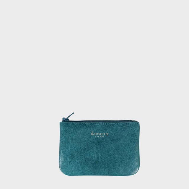 Poppy' Full Grain Leather Zip Top Coin Purse Assots 'Poppy' is a cute mini leather accessory handcrafted to compliment your collection of genuine leather handbags. Its simple and compact design is what makes this leather coin purse super practical and purposeful. Whether you prefer to carry one in lieu of a purse or keep one filled with change tucked inside your handbag, these pretty little things come in assorted colours.
Develops a unique rich patina with use to cherish over the years to come. Secured zip top closure. Embellished with an Assots London golden foil logo in the front. Opens to a fully lined interior in matching colour. Composition: Body: 100% Genuine Leather. Lining: Polyester.
DISCLAIMER : All pictures shown are for illustration purpose only. Actual product colour may vary due to different ambience lighting or the screen display settings. Size- W12cm x H8.5cm x D1cm.