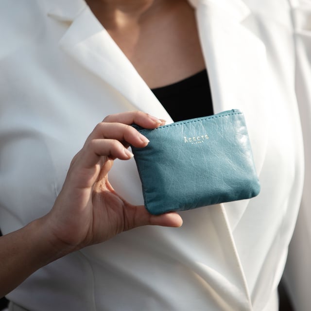 Poppy' Full Grain Leather Zip Top Coin Purse Assots 'Poppy' is a cute mini leather accessory handcrafted to compliment your collection of genuine leather handbags. Its simple and compact design is what makes this leather coin purse super practical and purposeful. Whether you prefer to carry one in lieu of a purse or keep one filled with change tucked inside your handbag, these pretty little things come in assorted colours.
Develops a unique rich patina with use to cherish over the years to come. Secured zip top closure. Embellished with an Assots London golden foil logo in the front. Opens to a fully lined interior in matching colour. Composition: Body: 100% Genuine Leather. Lining: Polyester.
DISCLAIMER : All pictures shown are for illustration purpose only. Actual product colour may vary due to different ambience lighting or the screen display settings. Size- W12cm x H8.5cm x D1cm.