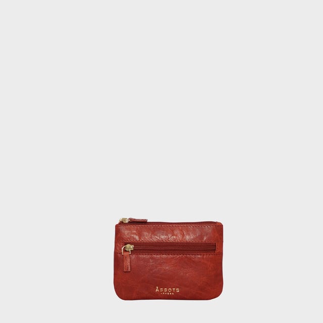 Keep things simple with this small coin purse crafted from super soft and supple natural grain Nappa leather. Featuring a simple compartment that opens along the top, the 'Mary' has a fully lined matching interior that is ideal for the basics. Comes in four more bright colours to spot easily in your bag.
Zip top closure. Zip pocket at the front. Embellished with gold metal zippers and an inimitable Assots London golden foil embossed logo. Fittings: Gold 
Composition: Body: 100% Genuine Leather. Lining: 100% Polyester.
DISCLAIMER : All pictures shown are for illustration purpose only. Actual product colour may vary due to different ambience lighting or the screen display settings. Size- W12.5cm x H9cm.