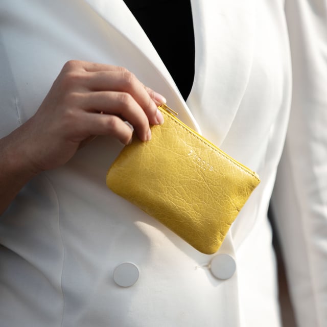 Poppy' Full Grain Leather Zip Top Coin Purse Assots 'Poppy' is a cute mini leather accessory handcrafted to compliment your collection of genuine leather handbags. Its simple and compact design is what makes this leather coin purse super practical and purposeful. Whether you prefer to carry one in lieu of a purse or keep one filled with change tucked inside your handbag, these pretty little things come in assorted colours.
Develops a unique rich patina with use to cherish over the years to come. Secured zip top closure. Embellished with an Assots London golden foil logo in the front. Opens to a fully lined interior in matching colour. Composition: Body: 100% Genuine Leather. Lining: Polyester.
DISCLAIMER : All pictures shown are for illustration purpose only. Actual product colour may vary due to different ambience lighting or the screen display settings. Size- W12cm x H8.5cm x D1cm.