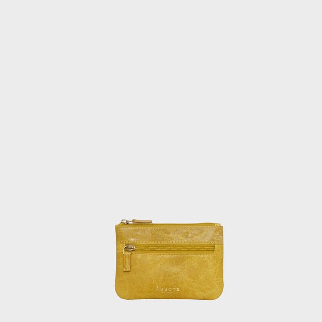 Keep things simple with this small coin purse crafted from super soft and supple natural grain Nappa leather. Featuring a simple compartment that opens along the top, the 'Mary' has a fully lined matching interior that is ideal for the basics. Comes in four more bright colours to spot easily in your bag.
Zip top closure. Zip pocket at the front. Embellished with gold metal zippers and an inimitable Assots London golden foil embossed logo. Fittings: Gold 
Composition: Body: 100% Genuine Leather. Lining: 100% Polyester.
DISCLAIMER : All pictures shown are for illustration purpose only. Actual product colour may vary due to different ambience lighting or the screen display settings. Size- W12.5cm x H9cm.