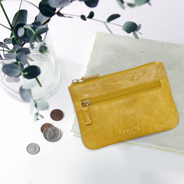 Keep things simple with this small coin purse crafted from super soft and supple natural grain Nappa leather. Featuring a simple compartment that opens along the top, the 'Mary' has a fully lined matching interior that is ideal for the basics. Comes in four more bright colours to spot easily in your bag.
Zip top closure. Zip pocket at the front. Embellished with gold metal zippers and an inimitable Assots London golden foil embossed logo. Fittings: Gold 
Composition: Body: 100% Genuine Leather. Lining: 100% Polyester.
DISCLAIMER : All pictures shown are for illustration purpose only. Actual product colour may vary due to different ambience lighting or the screen display settings. Size- W12.5cm x H9cm.