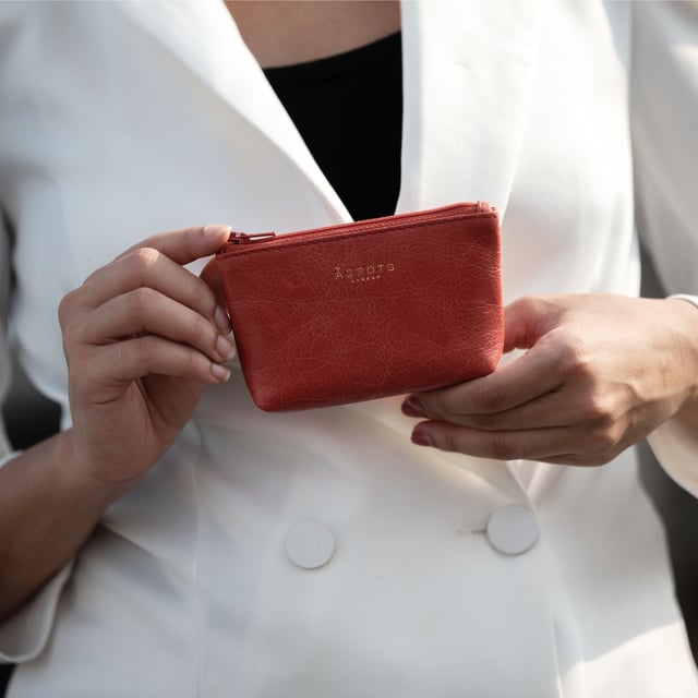 Assots 'Diana' is a cute mini leather accessory handcrafted to compliment your collection of genuine leather handbags. Its simple, compact and t-gusset design is what makes this leather coin purse super practical and purposeful. Whether you prefer to carry one in lieu of a purse or keep one filled with change tucked inside your handbag, these pretty little things come in assorted colours.
Develops a unique rich patina with use to cherish over the years to come. Secured zip top closure. T-gusset design provides extra space. Embellished with an Assots London golden foil logo in the front. Opens to a fully lined interior in matching colour. Composition: Body: 100% Genuine Leather Lining: Polyester.
DISCLAIMER : All pictures shown are for illustration purpose only. Actual product colour may vary due to different ambience lighting or the screen display settings. Size- W13cm x H8.5cm x D2cm.
